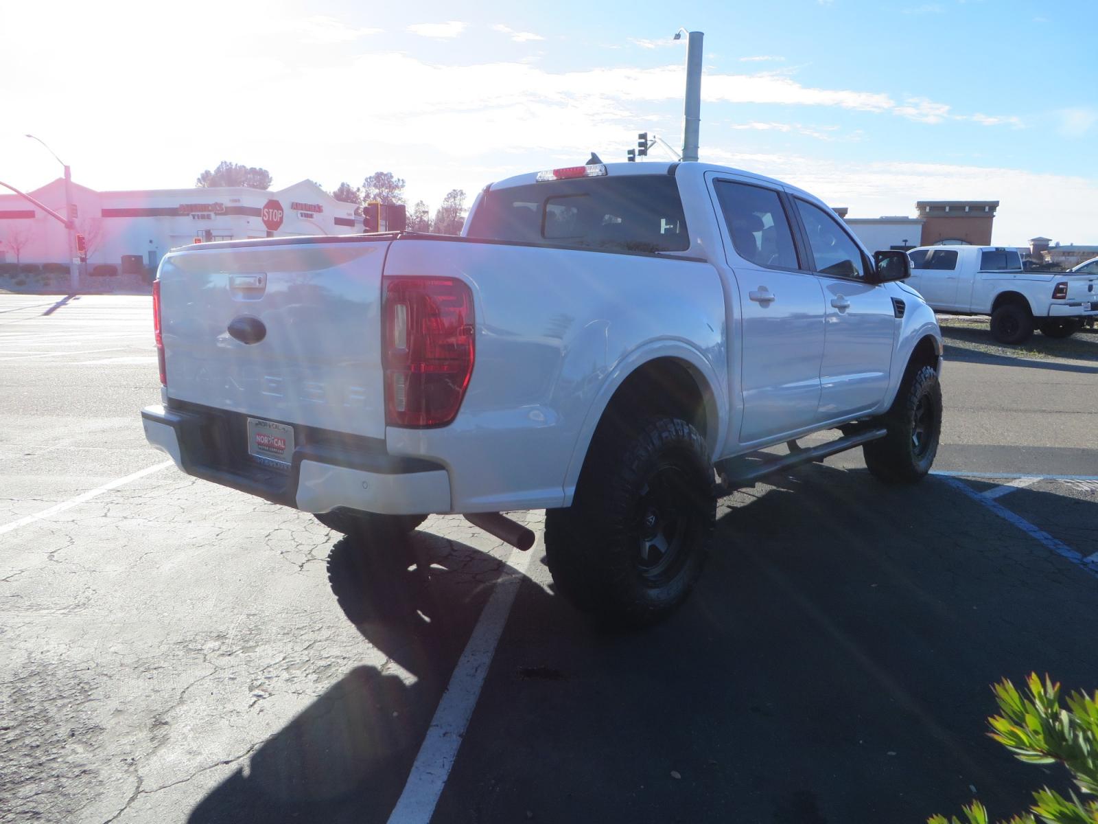 2019 White /Black Ford Ranger Lariat (1FTER4FHXKL) with an 2.3L engine, automatic transmission, located at 2630 Grass Valley Highway, Auburn, CA, 95603, (530) 508-5100, 38.937893, -121.095482 - Features a Fabtech suspension system, Fuel Offroad wheels, Nitto Ridge Grappler tires, Westin Running boards, and a Bakflip. - Photo #4